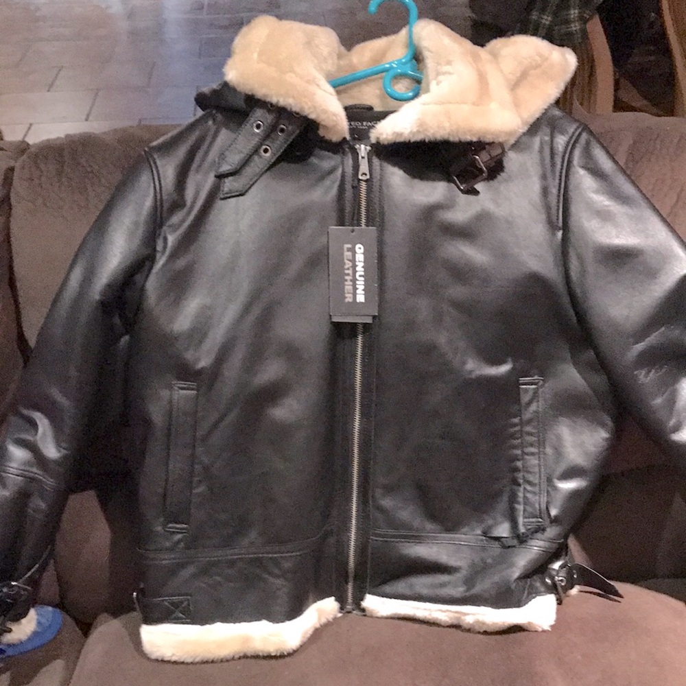 Brown leather jacket. Men’s size large. United Face New York brand.